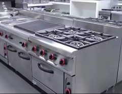 stainless steel industrial fryer in a commercial kitchen