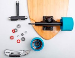 Skater cleaning skateboard bearings for smoother performance