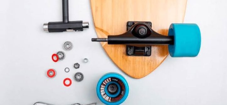 Skater cleaning skateboard bearings for smoother performance