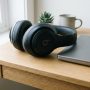 Hands opening an authentic retail box of discounted Beats headphones.