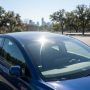 Car solar panel reflecting sunlight in Austin Texas