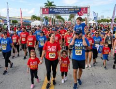 Families and supporters walking together at the St. Jude Walk Miami 2026 on September 26 at the Miami Dade County Fair and Expo Center wearing St. Jude fundraising gear