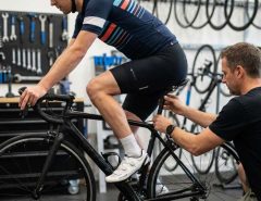 Cyclist adjusting saddle before long Boulder ride
