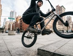 Close-up of durable metal BMX pedals on a street bike in New York.